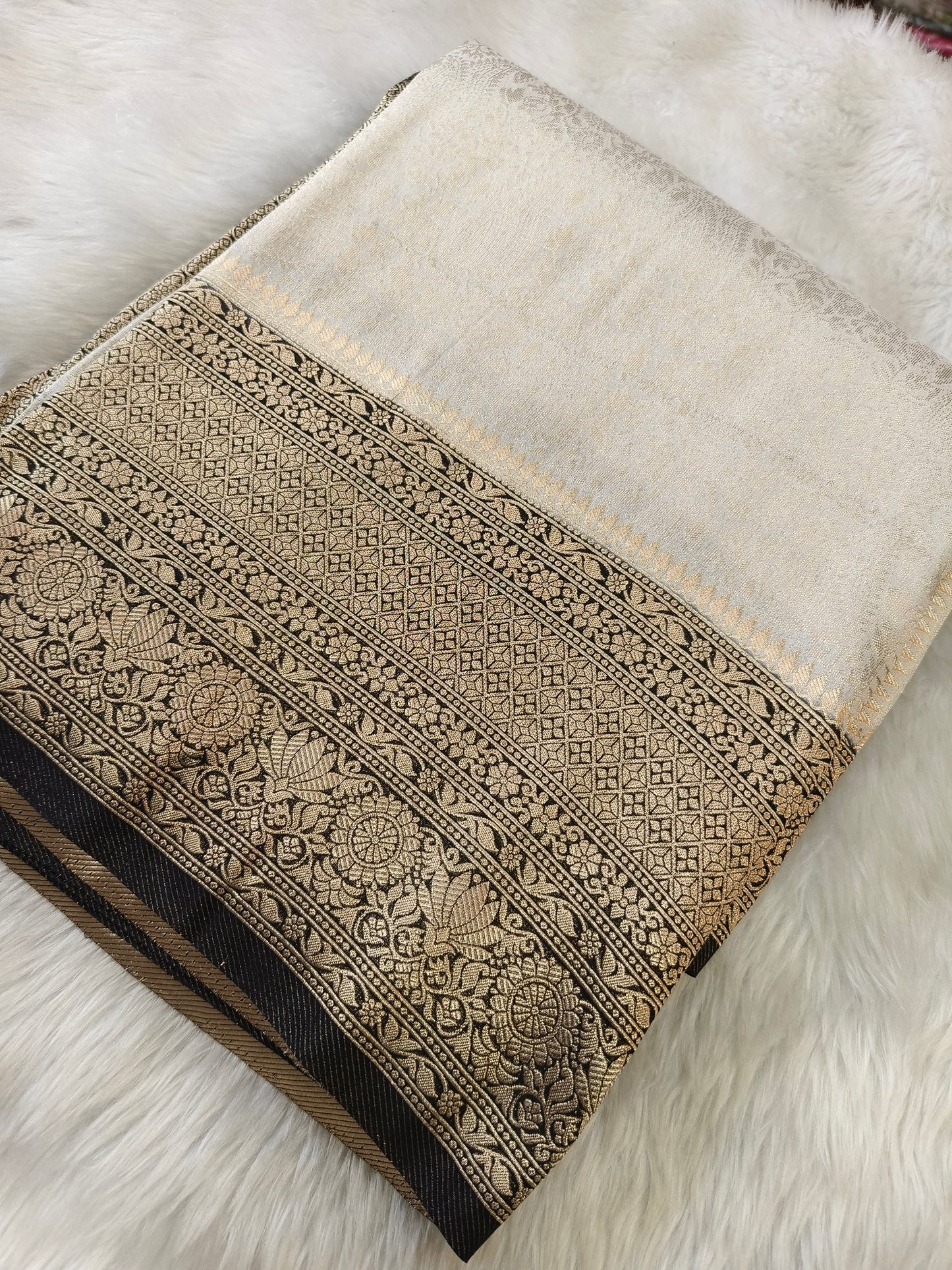 Grayish white brocade semi silk saree