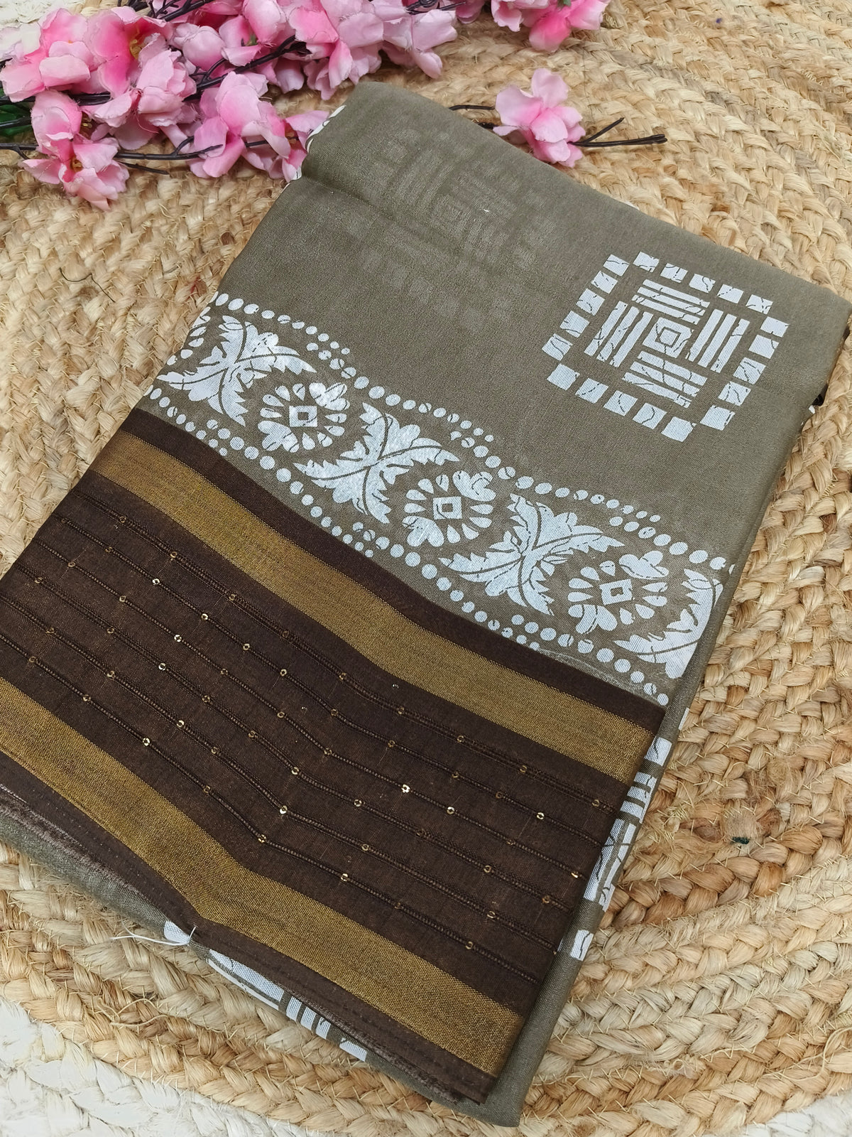 Light grey with brown sequence saree