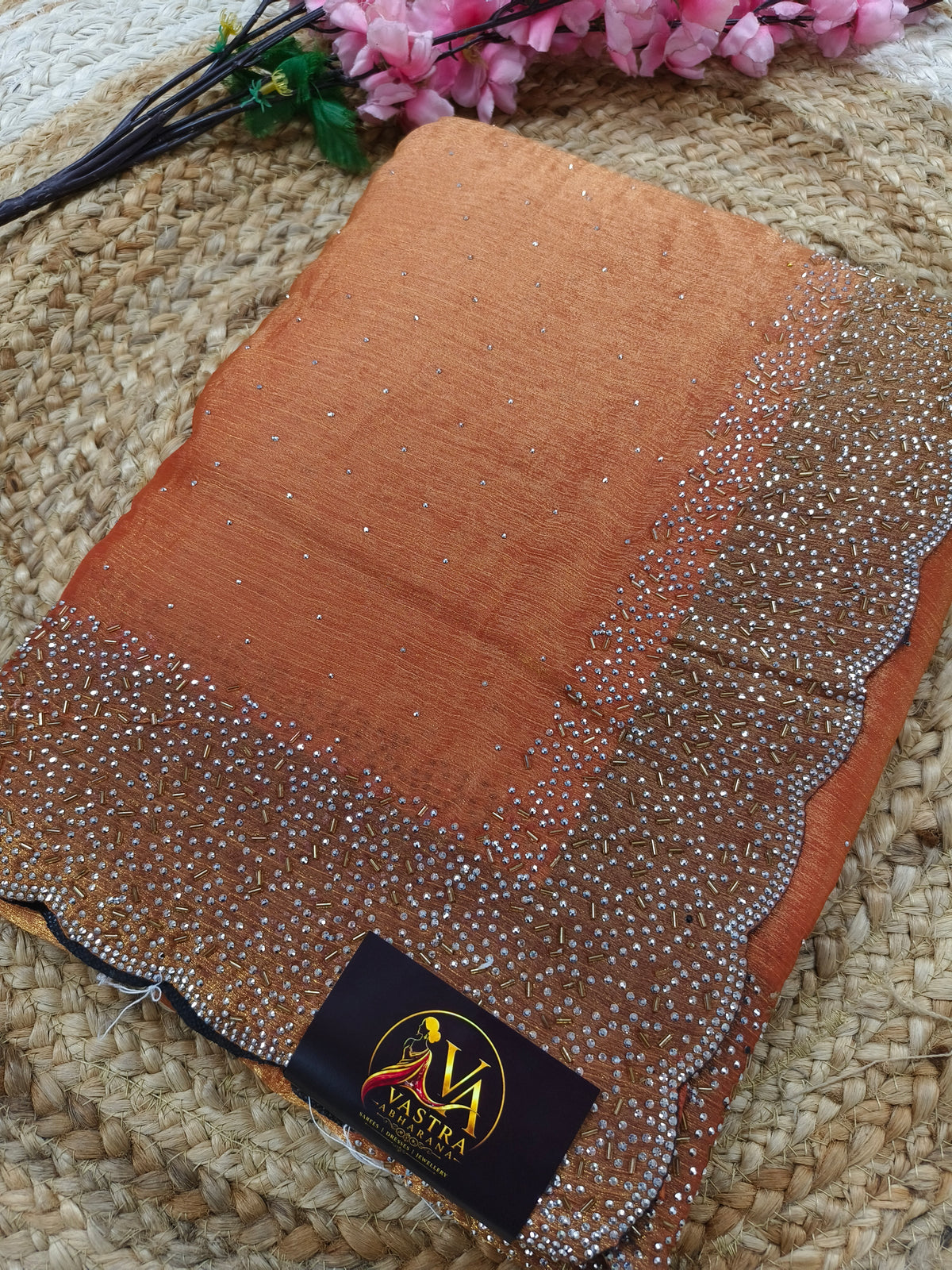 Light orange designer Georgette saree