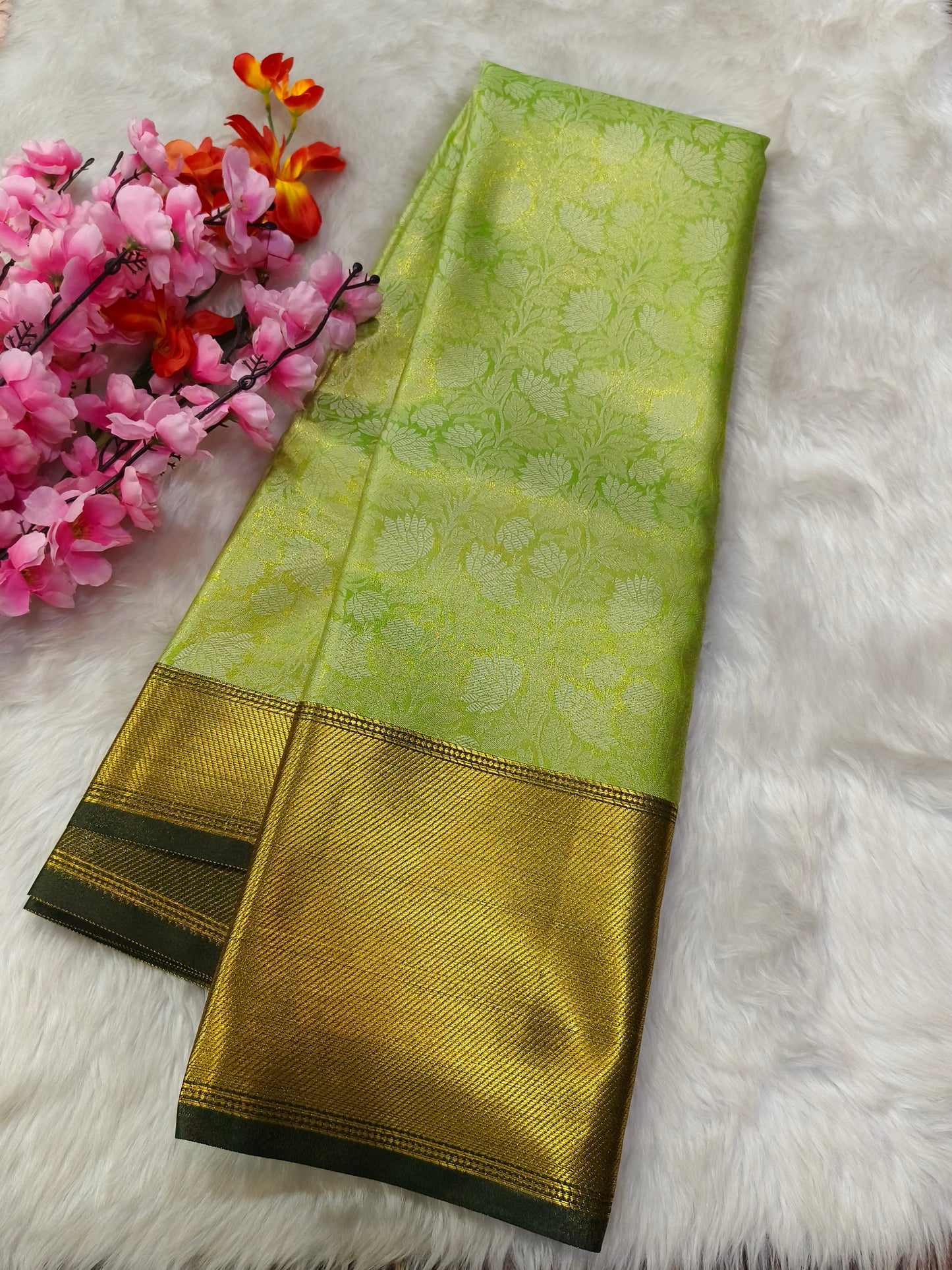Green Celebrity inspired soft golden tissue saree
