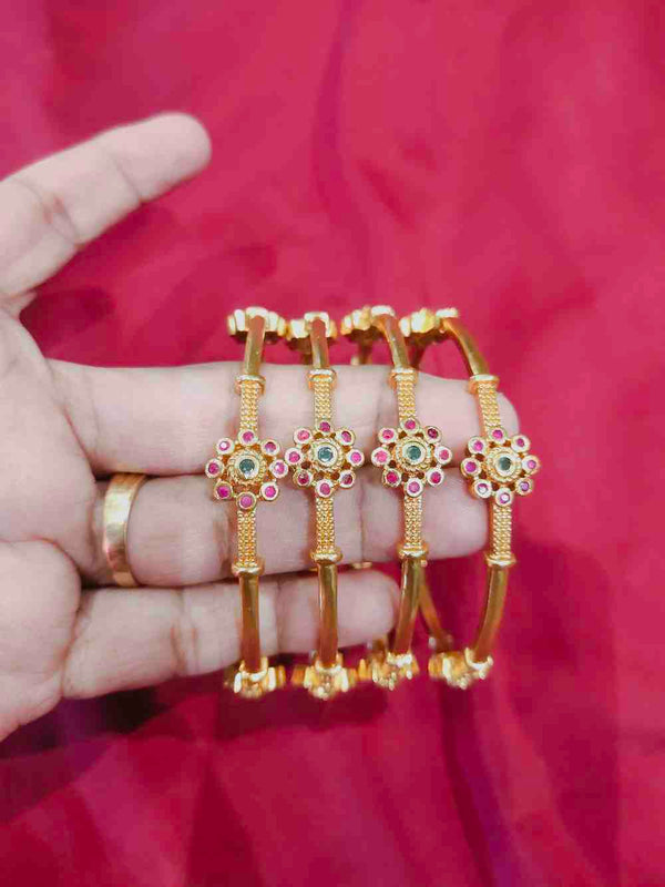 GOLD PLATED BANGLE WITH FLORAL RUBY STONE
