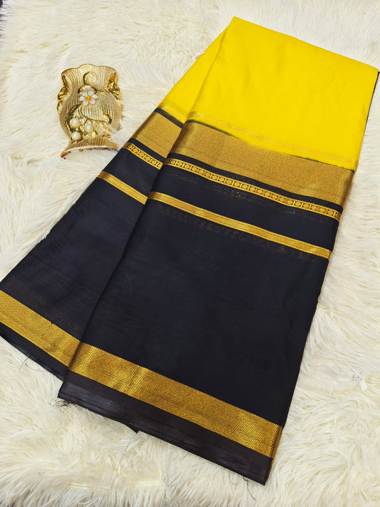 Yellow with black crepe silk saree