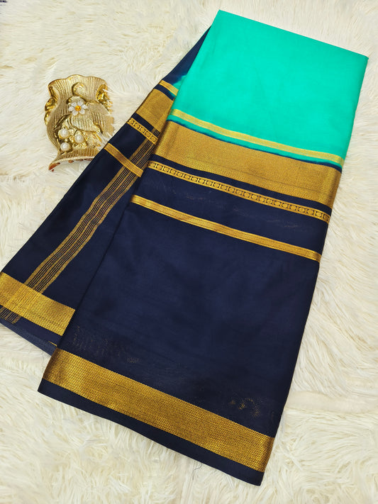 Sea-green with navy blue crepe silk saree