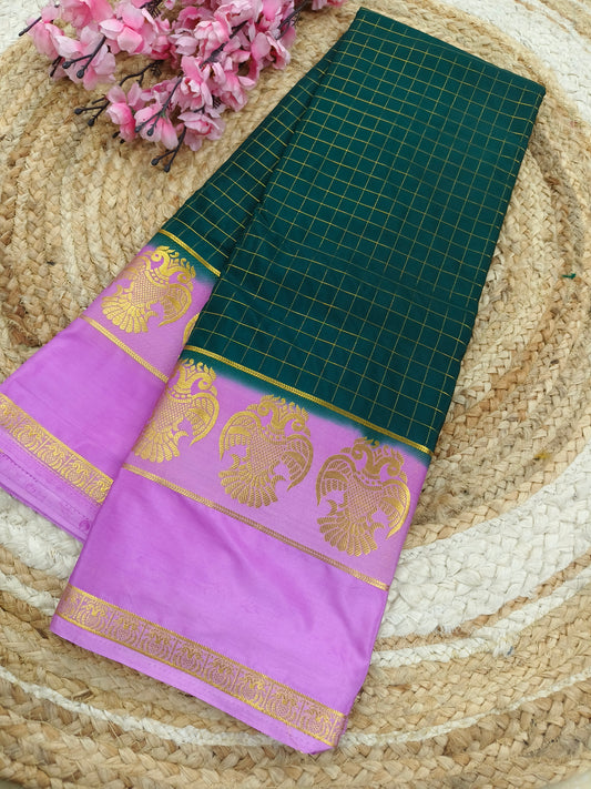 Bottle green with rose pink crape silk saree