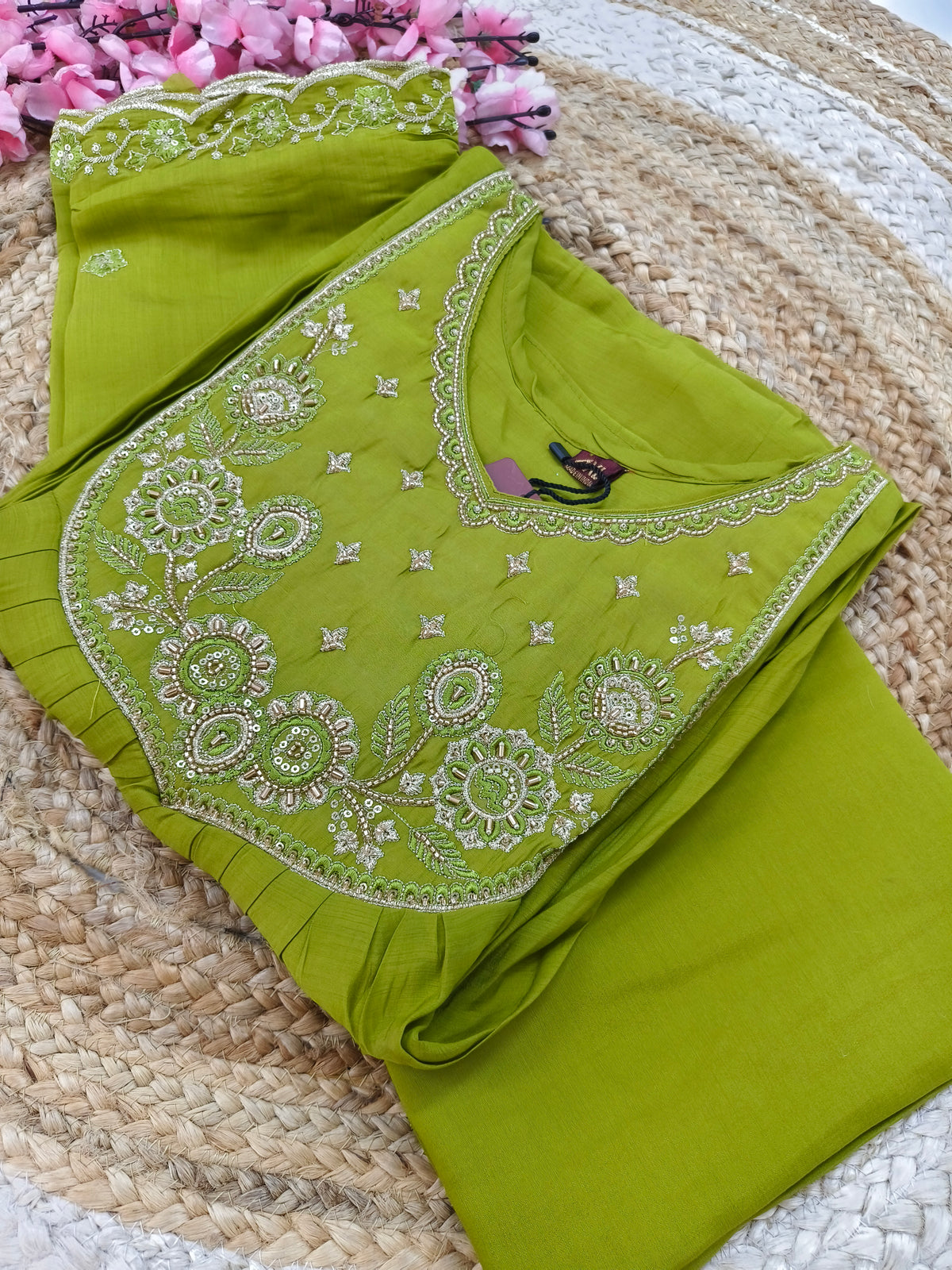 Green designer Aline suit