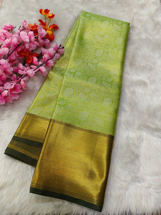 Green Celebrity inspired soft golden tissue saree