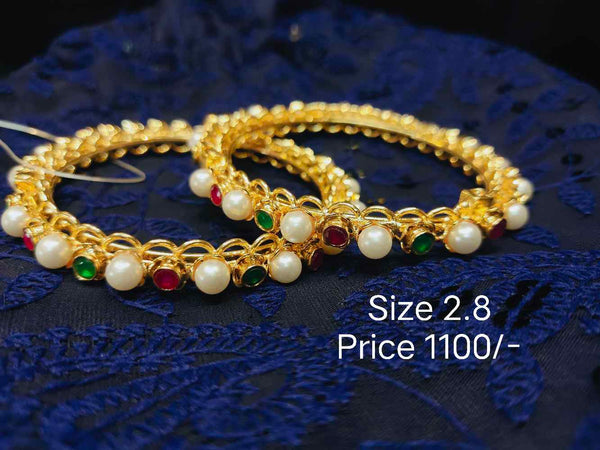 Pearl bangle with stones
