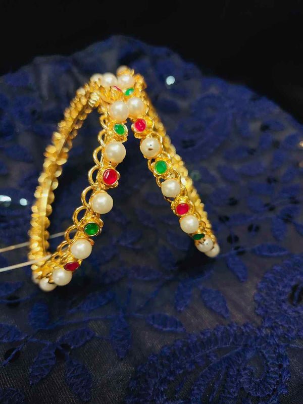 Pearl bangle with stones