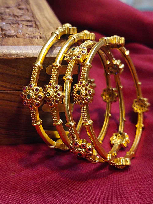 GOLD PLATED BANGLE WITH FLORAL RUBY STONE